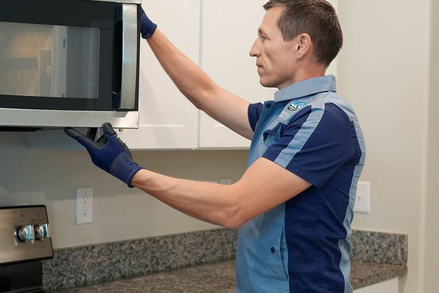 Professional microwave repair technician