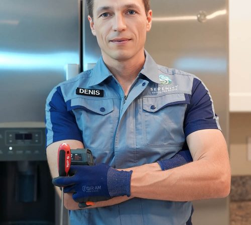 Serenity Appliance Repair technician standing in a kitchen with professional appliance repair tools